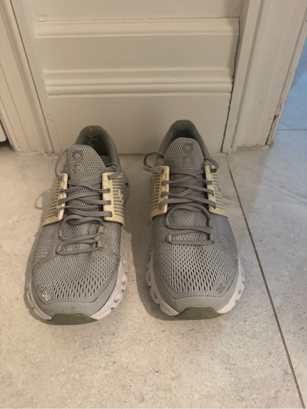 On Running Women’s Athletic Shoes in Light Gray with Cream Accents